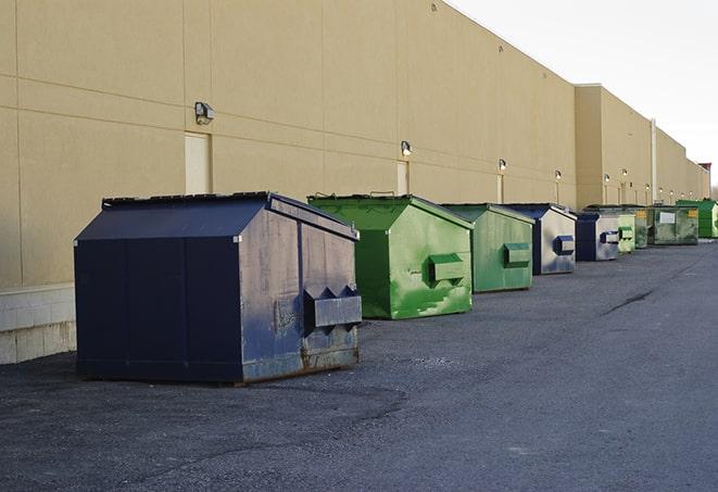 a view of a dumpster truck on a construction site in Amory